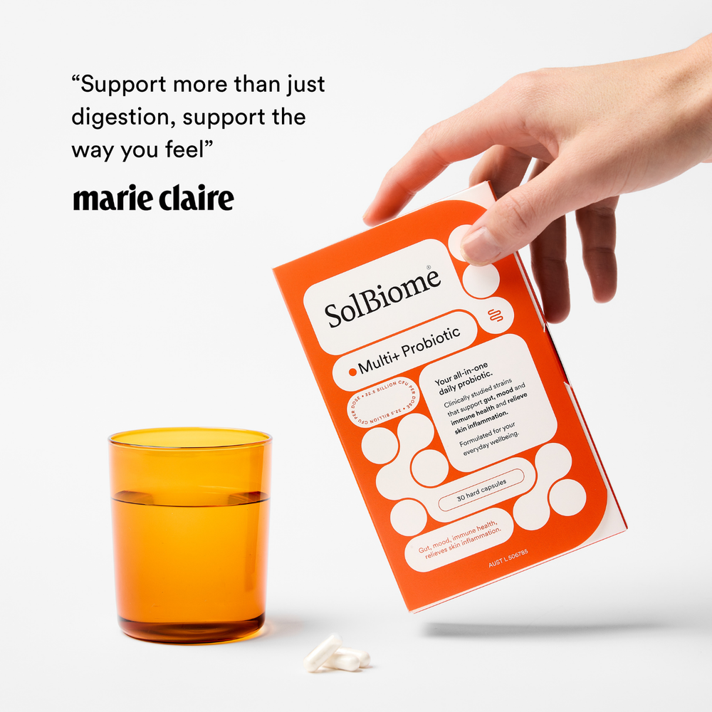 SolBiome probiotic package with a glass of water on a white background, featuring Marie Claire feature and quote.
